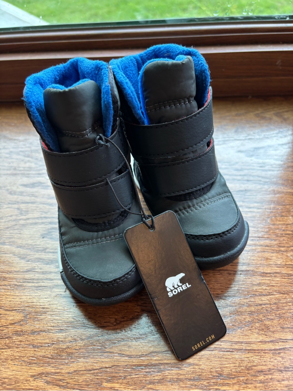 Sorel Kids Black Winter Boots with Bright Blue Lining